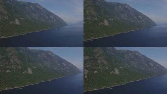 阿尔泰山脉与蓝天之间的Teletskoye湖高清在线视频素材下载