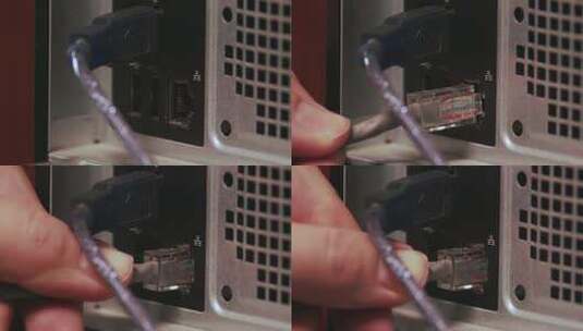 一只男性手将网线插入电脑插孔的特写镜头。跳线已连接高清在线视频素材下载