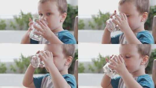 可爱的小男孩喝一杯水高清在线视频素材下载