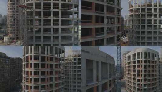 航拍城市高层公寓楼和起重机施工高清在线视频素材下载