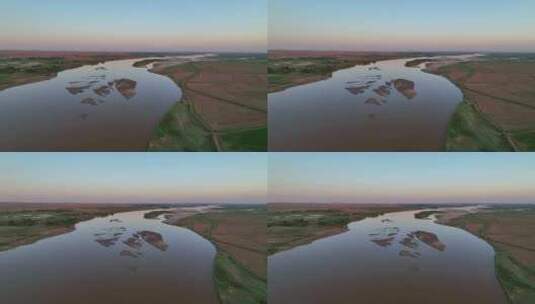 航拍宁夏石嘴山夕阳下的黄河湿地石嘴子公园高清在线视频素材下载