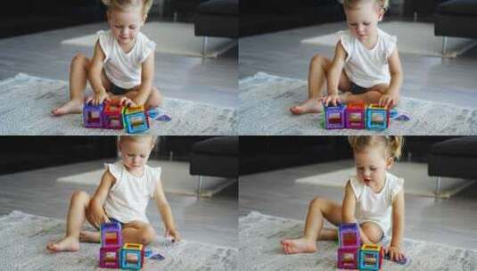 小女孩在家玩彩色磁铁塑料块套件高清在线视频素材下载