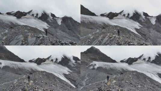 航拍攀登川西贡嘎山卫峰乌库楚雪山的登山者高清在线视频素材下载