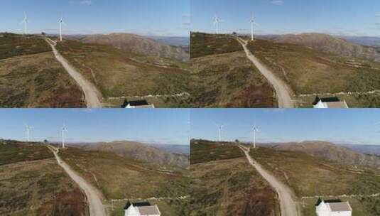 电力风车下的高速公路航拍景观高清在线视频素材下载