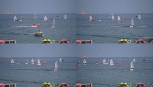 海边玩帆船的人们高清在线视频素材下载