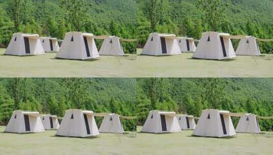 阳光下草地上露营地帐篷高清在线视频素材下载