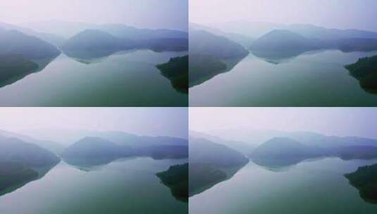平静湖面和重峦叠嶂的山脉高清在线视频素材下载
