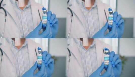 医生手持新冠疫苗特写镜头高清在线视频素材下载