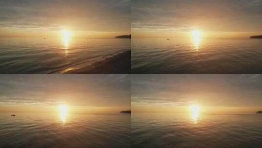 航拍海上日出海平面渔船海洋朝阳东方红太阳高清在线视频素材下载
