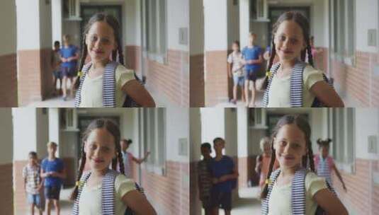 快乐的女孩站在学校走廊上高清在线视频素材下载