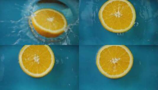 新鲜橙片水果落在水中高清在线视频素材下载