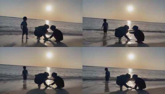 妈妈和两个孩子在海边玩耍的剪影高清在线视频素材下载