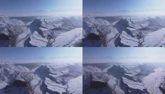 航拍新疆冬季安集海大峡谷红色山脉雪山河流高清在线视频素材下载