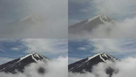 富士山穿过云层，越过云层。云层像窗帘一样高清在线视频素材下载