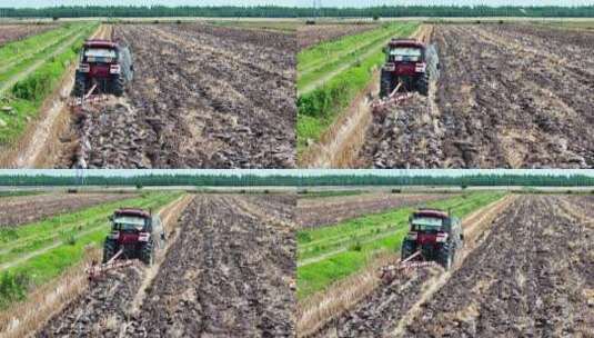 航拍农村农场夏耕农业机械翻整土地高清在线视频素材下载