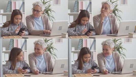 祖母和孙女使用智能手机和电脑高清在线视频素材下载