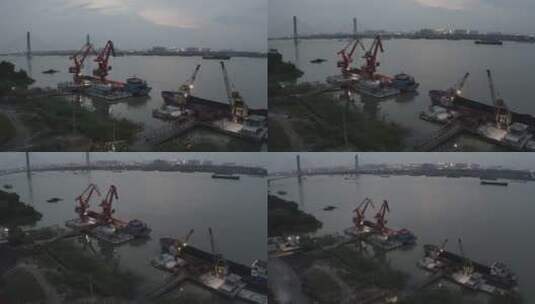 航拍港口码头门坐式吊装装卸散装货物高清在线视频素材下载