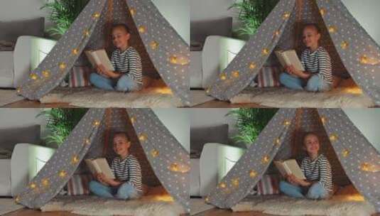 女孩在帐篷里看书高清在线视频素材下载