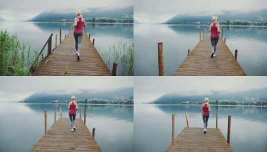 阿尔卑斯山湖边的早晨女人在跑步高清在线视频素材下载
