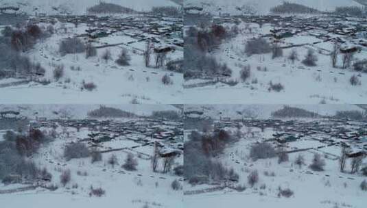 航拍春天大雪后的林区雪村人家高清在线视频素材下载