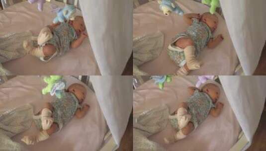 不安分的婴儿躺在床上高清在线视频素材下载