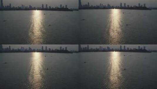 旅游景区航拍南京玄武湖摇跟手划船 大厦高清在线视频素材下载
