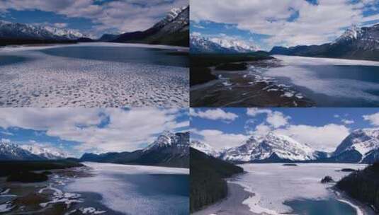 冬季航拍雪山结冰的湖泊公路上行驶的汽车高清在线视频素材下载