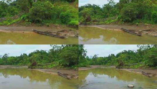 木制独木舟躺在热带河流的沙洲上高清在线视频素材下载