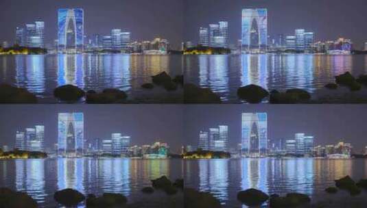 苏州金鸡湖和东方之门城市建筑夜景灯光高清在线视频素材下载