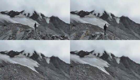 航拍攀登川西贡嘎山卫峰乌库楚雪山的登山者高清在线视频素材下载