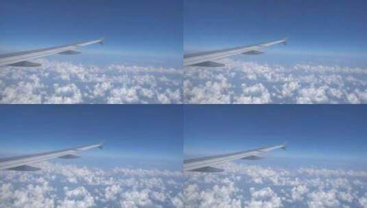 飞行中的机翼下的蓝天白云高清在线视频素材下载