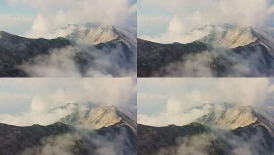 航拍雾蒙蒙的雪山山峰高清在线视频素材下载