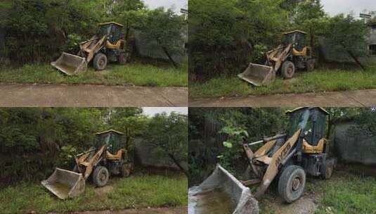 户外草地停放着一辆装载机高清在线视频素材下载