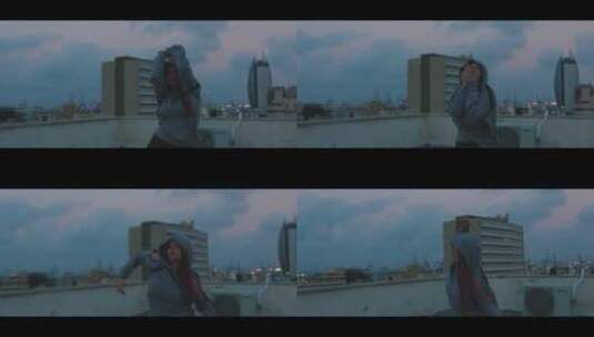 女人在屋顶活力的跳舞高清在线视频素材下载