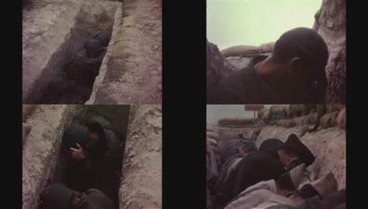 士兵蹲在地坑里躲避轰炸高清在线视频素材下载