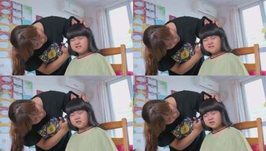 升格实拍为女儿剪发的中国母亲高清在线视频素材下载