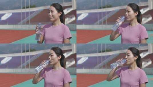 中国人女性运动后休息喝水饮用矿泉水高清在线视频素材下载