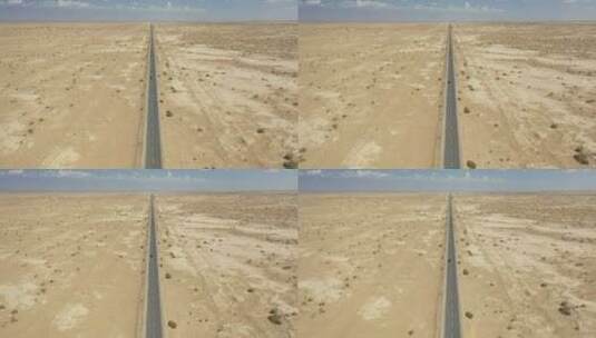 新疆塔里木盆地戈壁荒漠笔直的公路高清在线视频素材下载