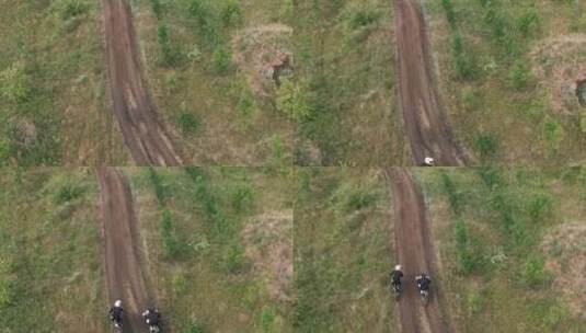 泥泞的道路上骑摩托车越野赛的人鸟瞰图高清在线视频素材下载