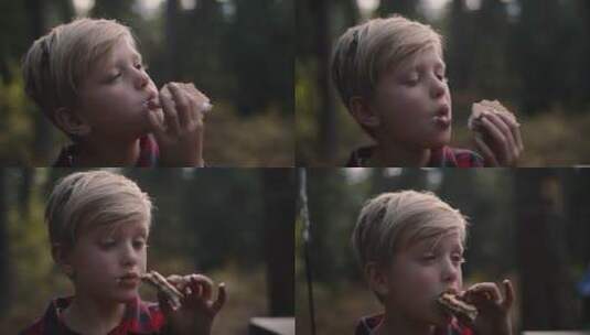 在户外吃面包的小男孩高清在线视频素材下载