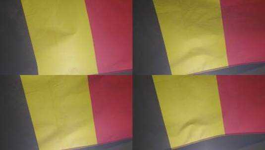 随风飘扬的比利时国旗特写高清在线视频素材下载