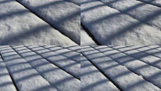 冬天下雪天 积雪  阳光下的栅栏影子 光影高清在线视频素材下载