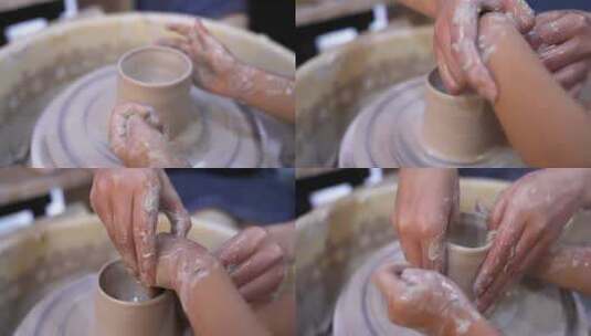 陶艺特写旋转泥坯塑形大手握小手传承技艺高清在线视频素材下载