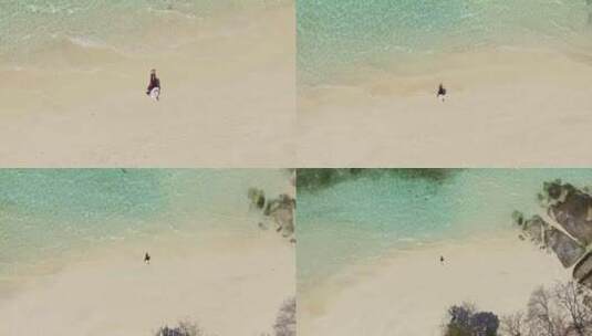 沙滩上一个女人躺在沙滩上晒太阳的鸟瞰图高清在线视频素材下载