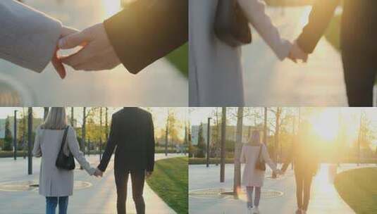 年轻夫妇手牵着手在公园散步高清在线视频素材下载