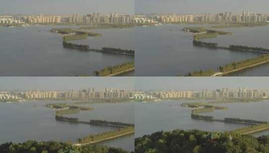 航拍武汉东湖绿道傍晚远处城市高清在线视频素材下载