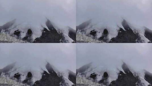 航拍云雾中的四川横断山脉乌库楚雪山风光高清在线视频素材下载