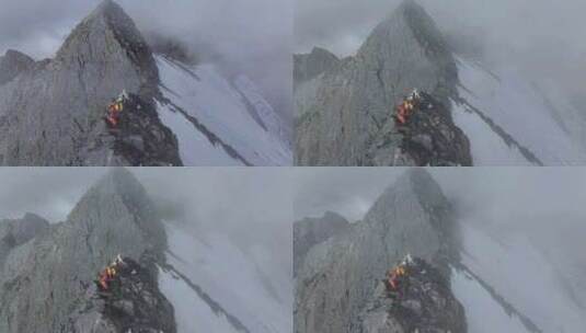 航拍登顶川西横断山脉乌库楚雪山的登山者高清在线视频素材下载