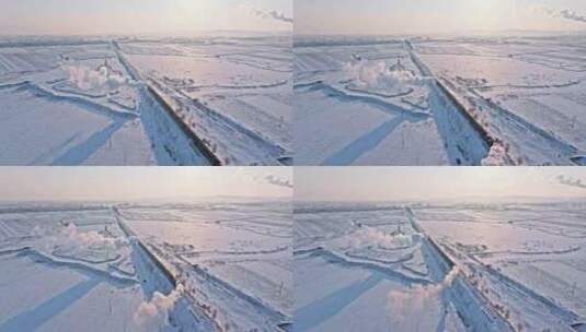 航拍中国东北冬季雪景中的蒸汽机车老火车高清在线视频素材下载