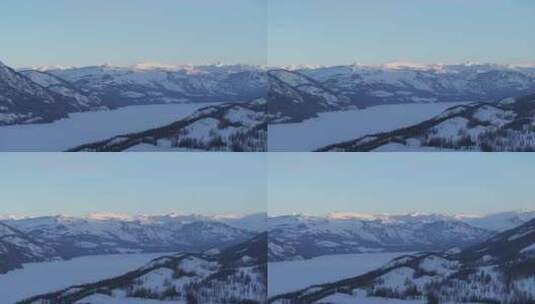 航拍新疆冬季喀纳斯河流晨雾雪山森林雪景高清在线视频素材下载